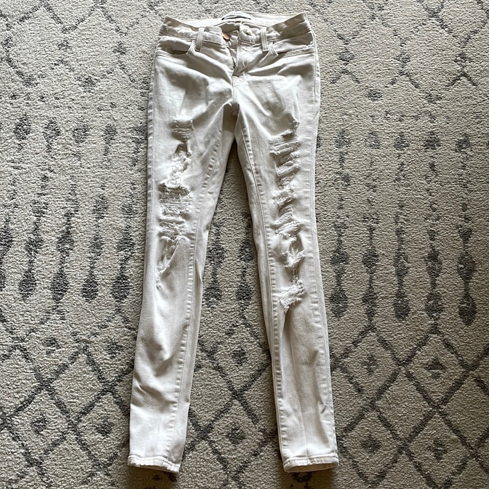 J brand stretch and distressed cream jeans size 25